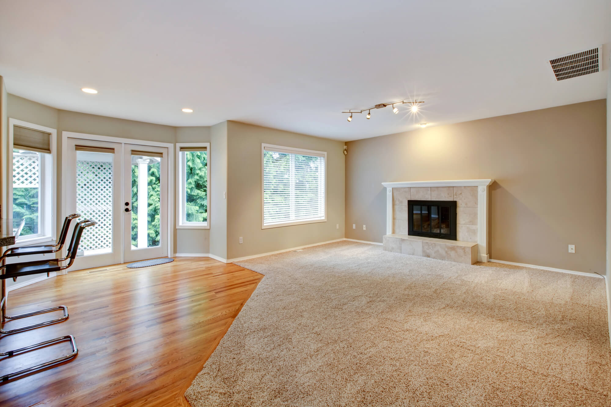 half living room covered with carpet