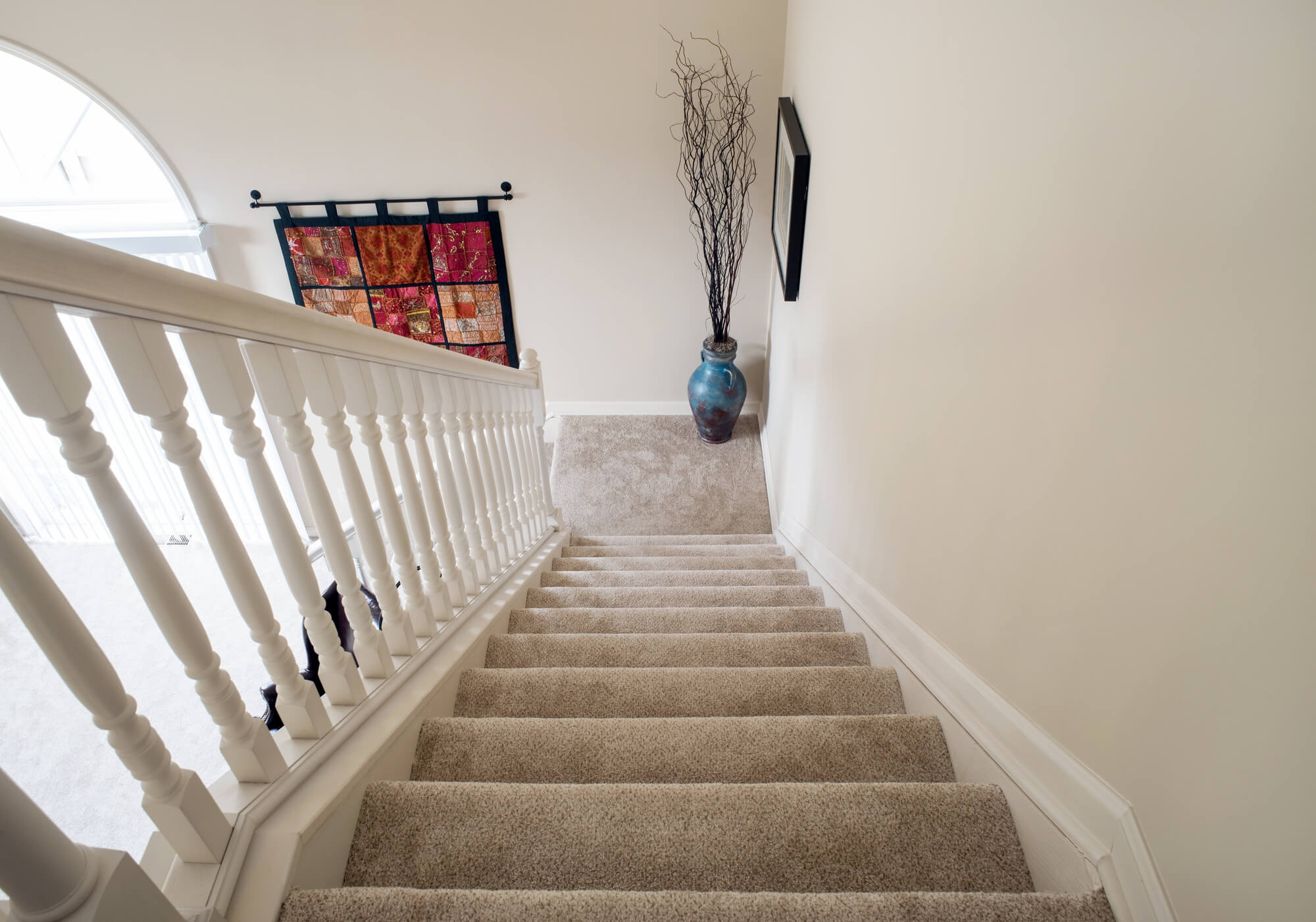 Straight stairs covered with carpet