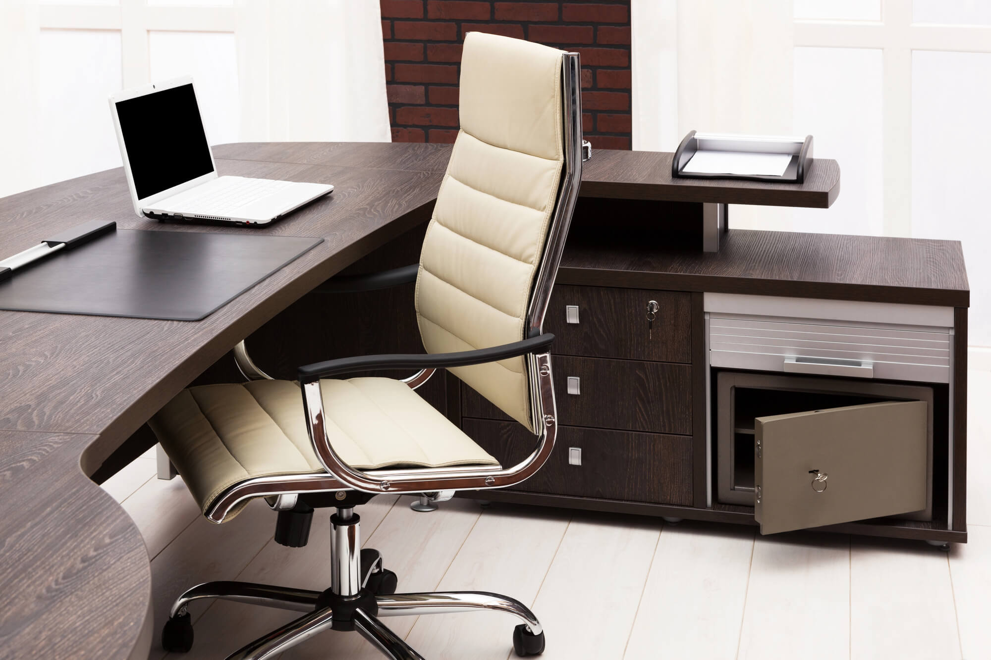 desk and a chair on a wooden floor